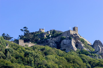 Fototapeta na wymiar View from downtown of Sintra to a half part of the medieval Castle of the Moors on a hilltop,in Portugal near Lisbon; Sintra Cultural Landscape, UNESCO World Heritage Site