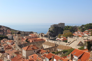Fototapeta premium medieval city roofs overlooking a castle