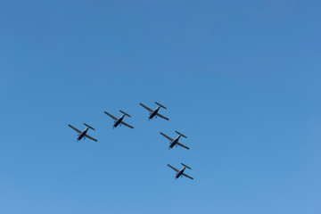 Five airplanes are flying in the sky