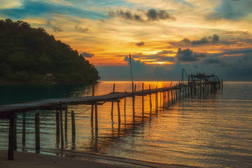 Fototapeta na wymiar wooden pier at sunset on Koh Kood in Thailand.