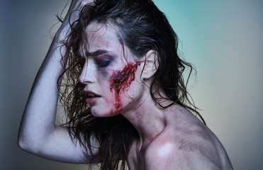Beautiful girl with a wounded face in the blood - 229296300