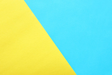 blue and yellow pastel background. Flat lay, Top view.