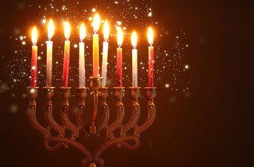 image of jewish holiday Hanukkah background with menorah (traditional candelabra) and candles.