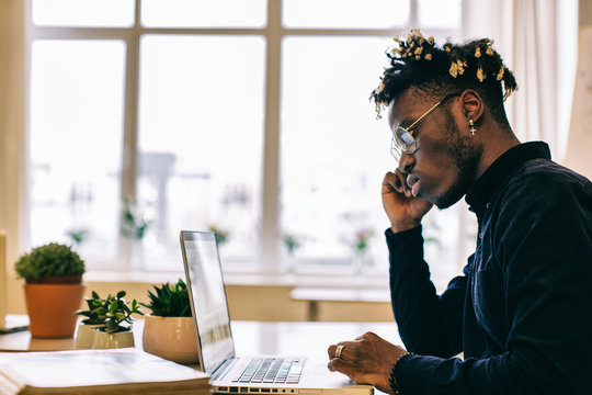 Profile of Hip African American Man Working on Laptop