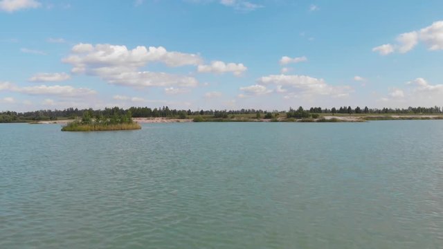 flight over the lake towards the forest