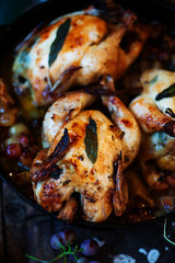 Roasted  cornish hens with grapes and apples.