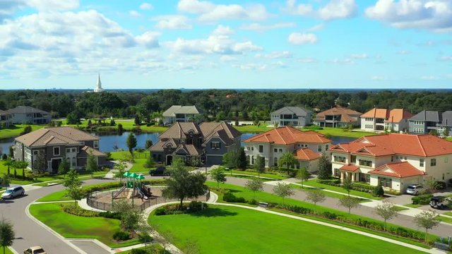 Drone footage of a luxury home development with park playground