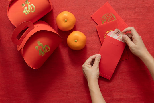 Preparing hongbao (red envelope)