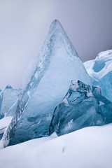 Beautiful crystal blue ice blocks, scenic winter landscape, close-up view