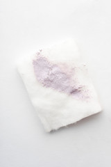 Brightening makeup base smudge on cotton pad