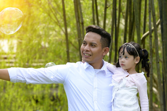 Malay Muslim Father And Child Outdoor