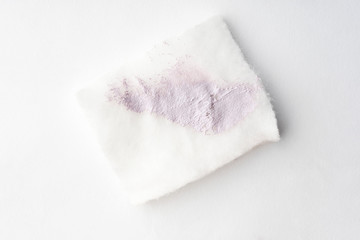 Brightening makeup base smudge on cotton pad