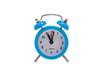 One small alarm clock on white, concept of being in time