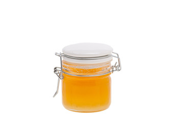 Sweet honey in jar isolated on white