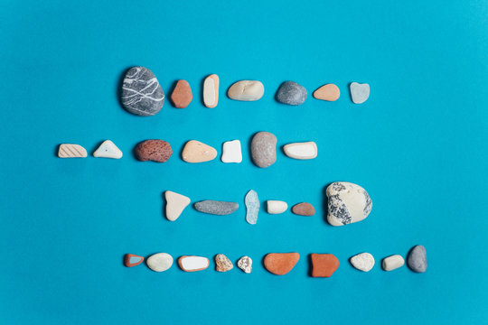 Rocks organized on a blue background