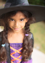 Young child dressed up as a witch for halloween