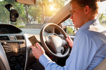 young male taxi driver use mobile phone to accept customer in applications service, taxi driver concept