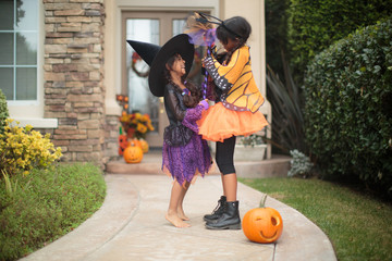 Two little girls having fun on Halloween