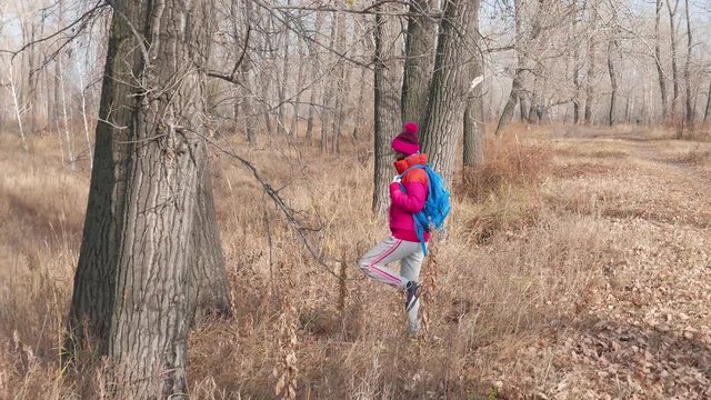 girl hides for a tree