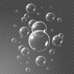 Realistic soap bubbles set isolated on the black transparent background. vector Illustration