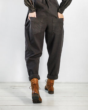 Woman posing with hands in pockets