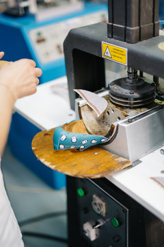 Person Using Press For Shoes Making