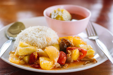 Curry and rice on the wooden table in the food shop