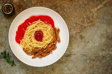 Fettuccine spaghetti pasta with tomatoes and herbs. Top view