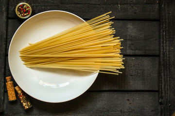 Fettuccine spaghetti pasta with tomatoes and herbs. Top view