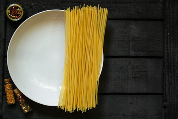 Fettuccine spaghetti pasta with tomatoes and herbs. Top view