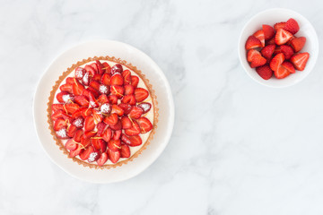 Strawberry Cake and Strawberries in a Bowl on White Marble