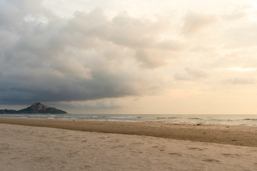 Morning sunrise beach with cloudy sky.