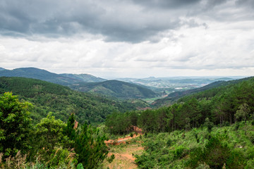 Fototapeta na wymiar Panoramic view of mountains and valleys in Dalat, Vietnam. Da lat is one of the best tourism cities and aslo one of the largest vegetable and flowers growing areas in Vietnam