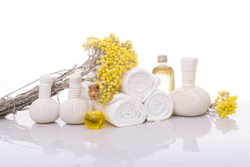 Products for spa towel, spa oil, branch yellow flower
