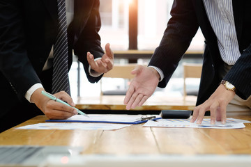 Closeup businessman consult and meeting with document finance paper.