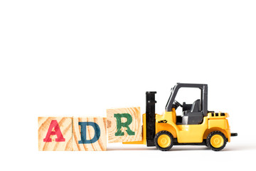 Toy forklift hold wood letter block A to complete word ADR (Abbreviation of Adverse drug reaction) on white background