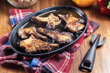Roasted lamb chops on a roasting dish