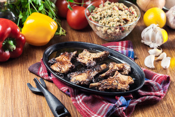 Roasted lamb chops on a roasting dish