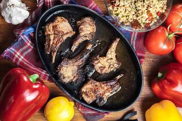 Roasted lamb chops on a roasting dish
