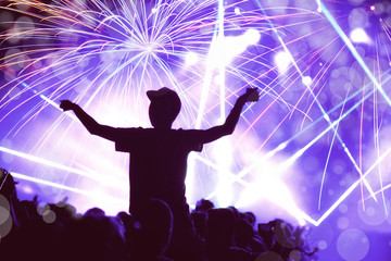 New Year concept, cheering crowd and fireworks