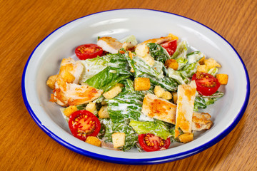 Caesar salad with grilled salmon