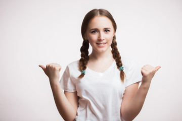 Beautiful young happy student girl smiling and showing thumbs up gesture