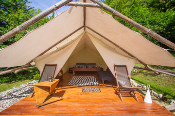Glamping tent exterior in Adrenaline Check eco camp in Slovenia.