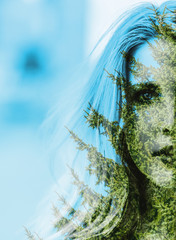 Double exposure of young woman and autumn forest.