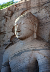 The closeup of stone image of Buddha Gautama in dhyana mudra, located in Gal Vihara,  near of Polonnaruwa - ancient capital of Sri Lanka.