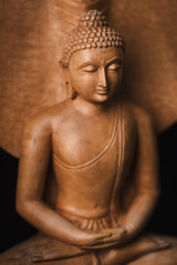 Buddha in a meditation pose, under protection of the king of nag - Mukalinda.