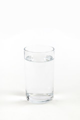 Glass of clean water on white background