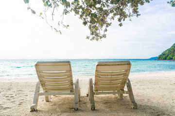 Two chair on sand beach in afternoon