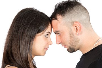 Portrait of a beautiful young happy couple forehead front touch