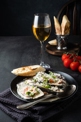 Fototapeta na wymiar Mussels with Blue Cheese Sauce and Garlic Baguette.